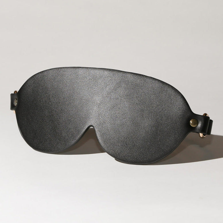 Gray sleep mask on a light gray background