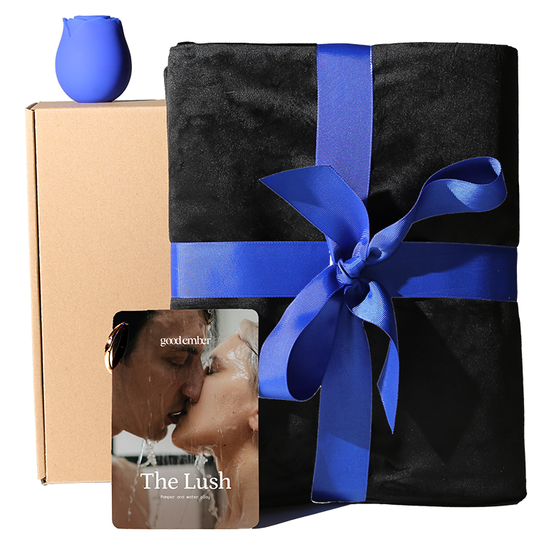 Black sex blanket with blue ribbon, rose vibrator, beige box on a white background